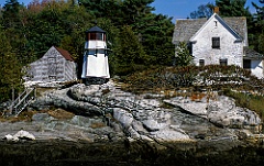 Weathered Perkins Island Light on Rocky Edge in Maine